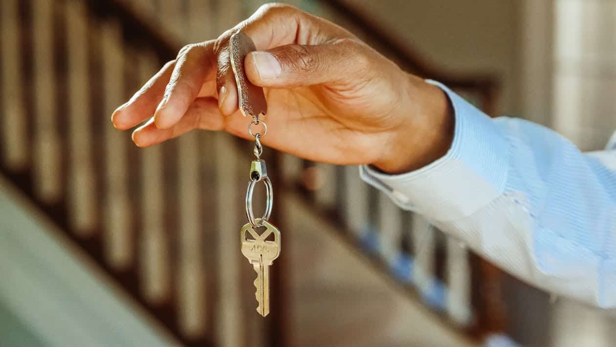 Hand holding vacation rental house key